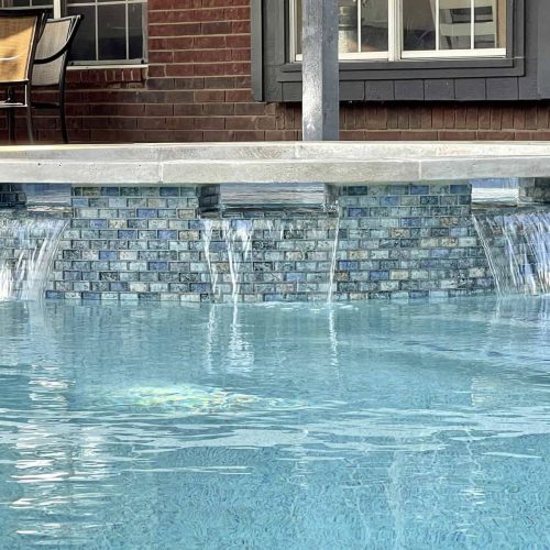 Travertine pool deck creates resort feel in Denton County 75068