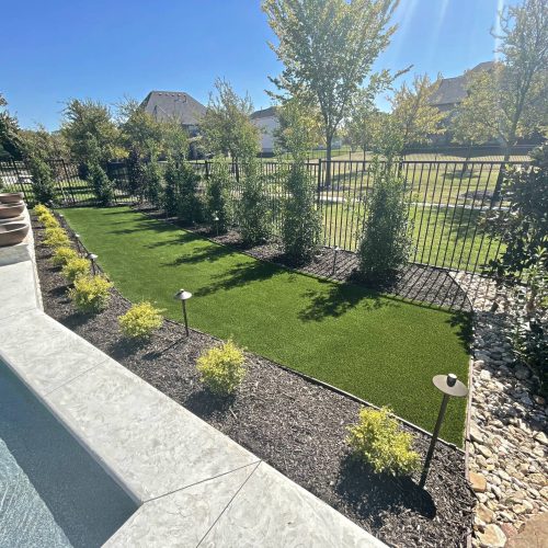Outdoor space and pristine turf in Copper Canyon 76226