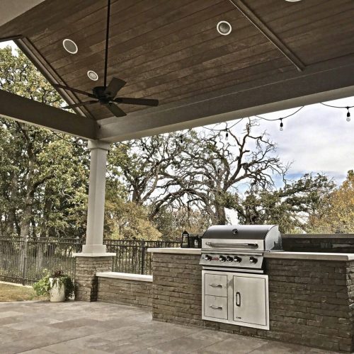 Create a cozy patio escape** featuring stylish pergolas, warm patio covers, and subtle ambient lighting in Flower Mound 76262