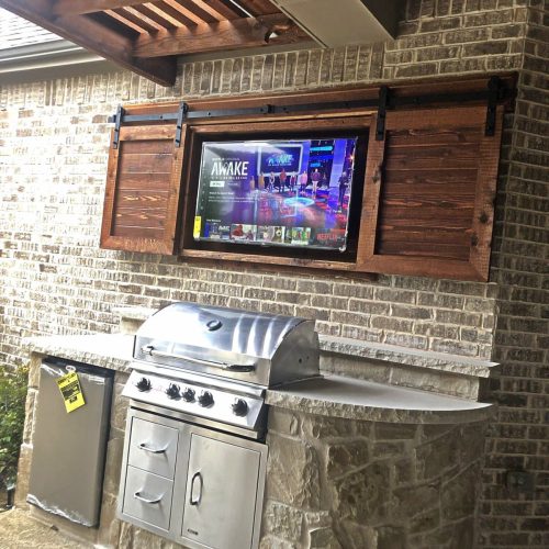 Outdoor kitchen and living space in North Lake 76226
