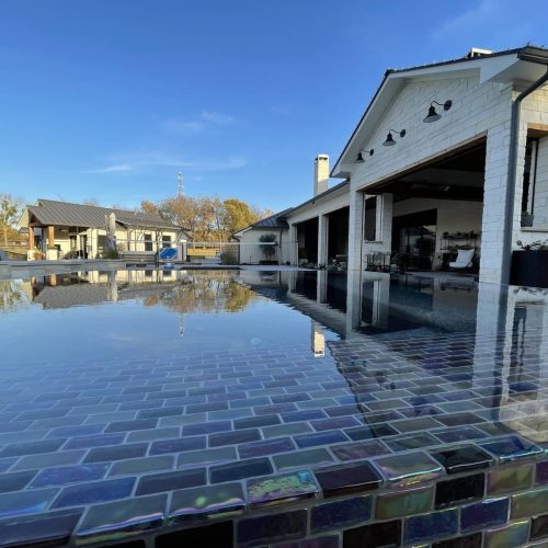 Travertine pool deck creates resort feel in Lewisville 75057