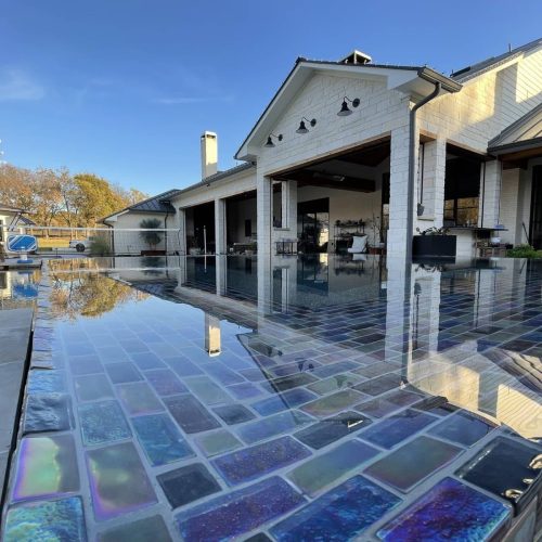 Travertine pool deck creates resort feel in Lewisville 75010