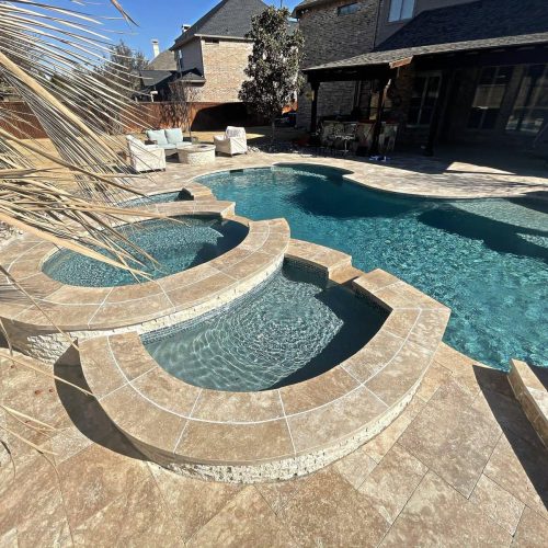 Inviting pool deck with travertine pavers in Harvest 76226