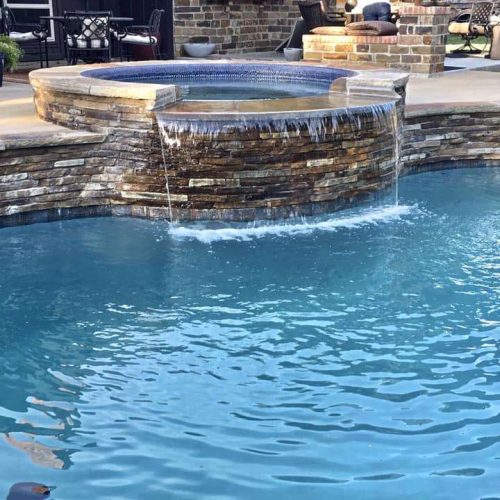 Inviting pool deck with travertine pavers in Plano 75093