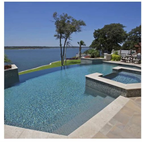 Travertine pool deck creates resort feel in Double Oak 75077